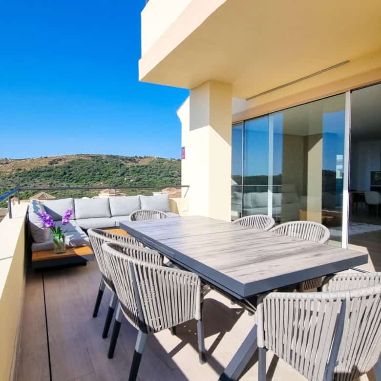 Elegant outdoor terrace with panoramic sea views and modern furniture. Perfect for relaxing and ente.