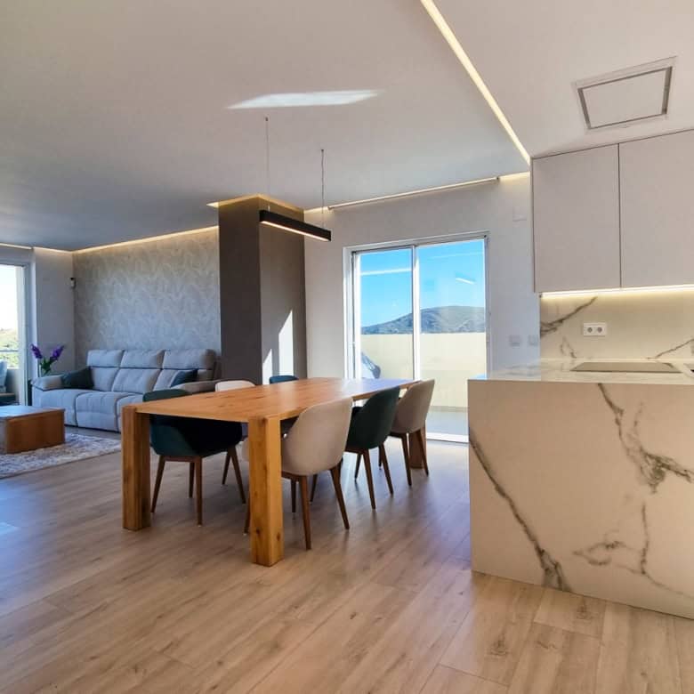 Elegant fully renovated penthouse showcasing panoramic sea views in San Roque Club. Modern interior.