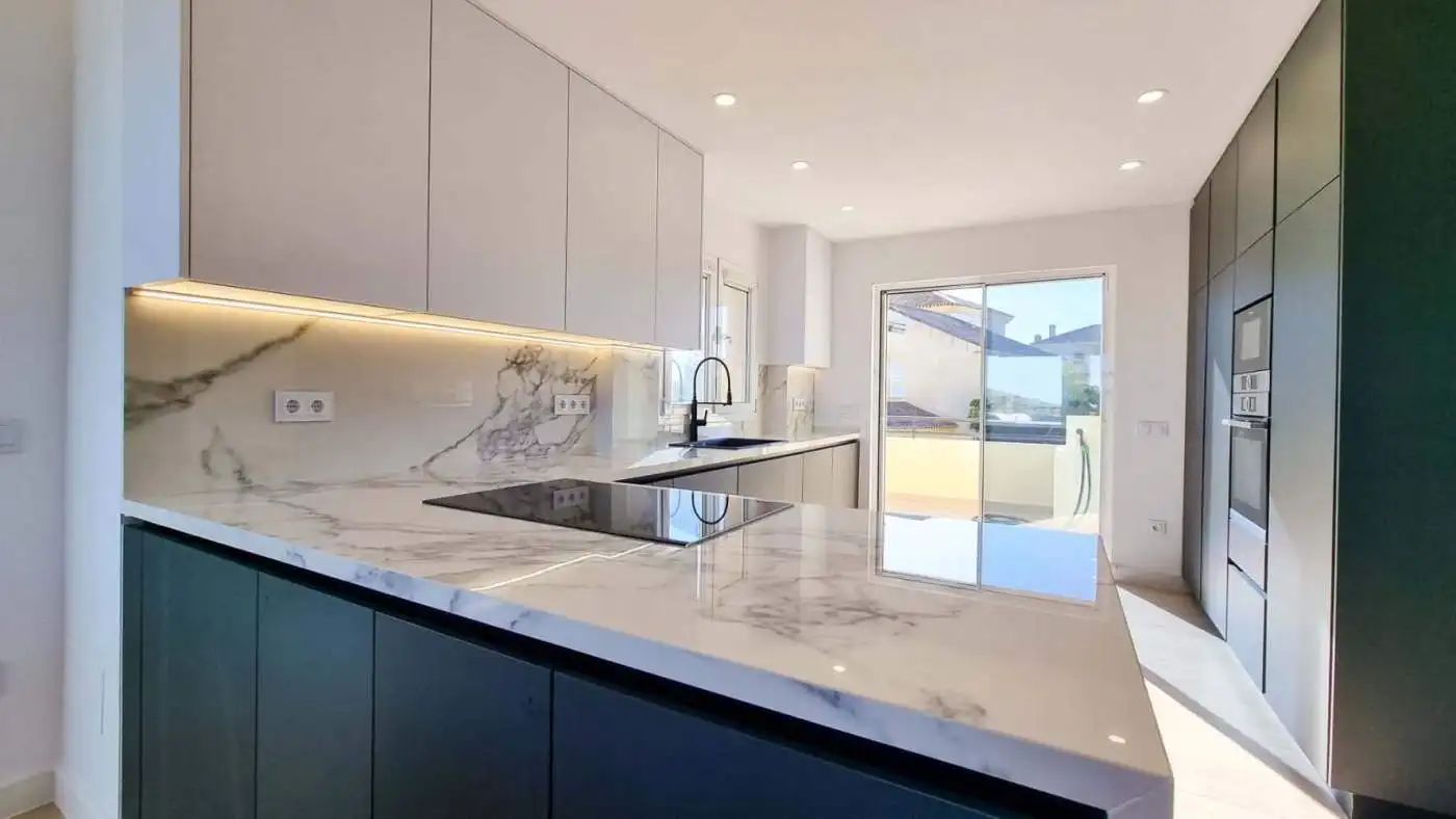 Contemporary kitchen in renovated penthouse with panoramic sea views in San Roque Club.