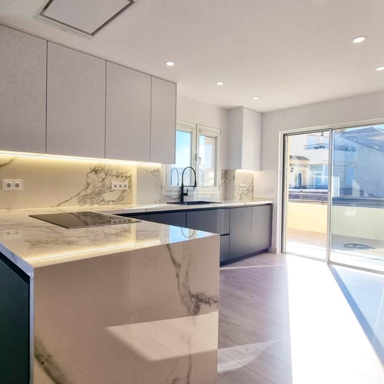 Contemporary fully renovated penthouse kitchen with panoramic sea views in San Roque Club.