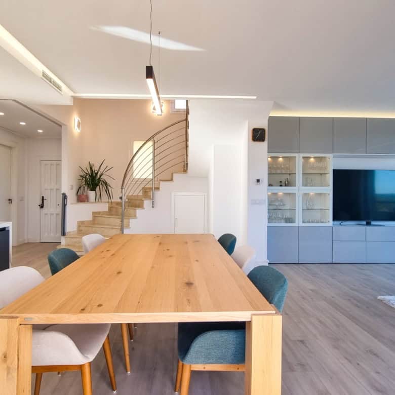 Elegant fully renovated penthouse showcasing panoramic sea views in San Roque Club. Modern interior.