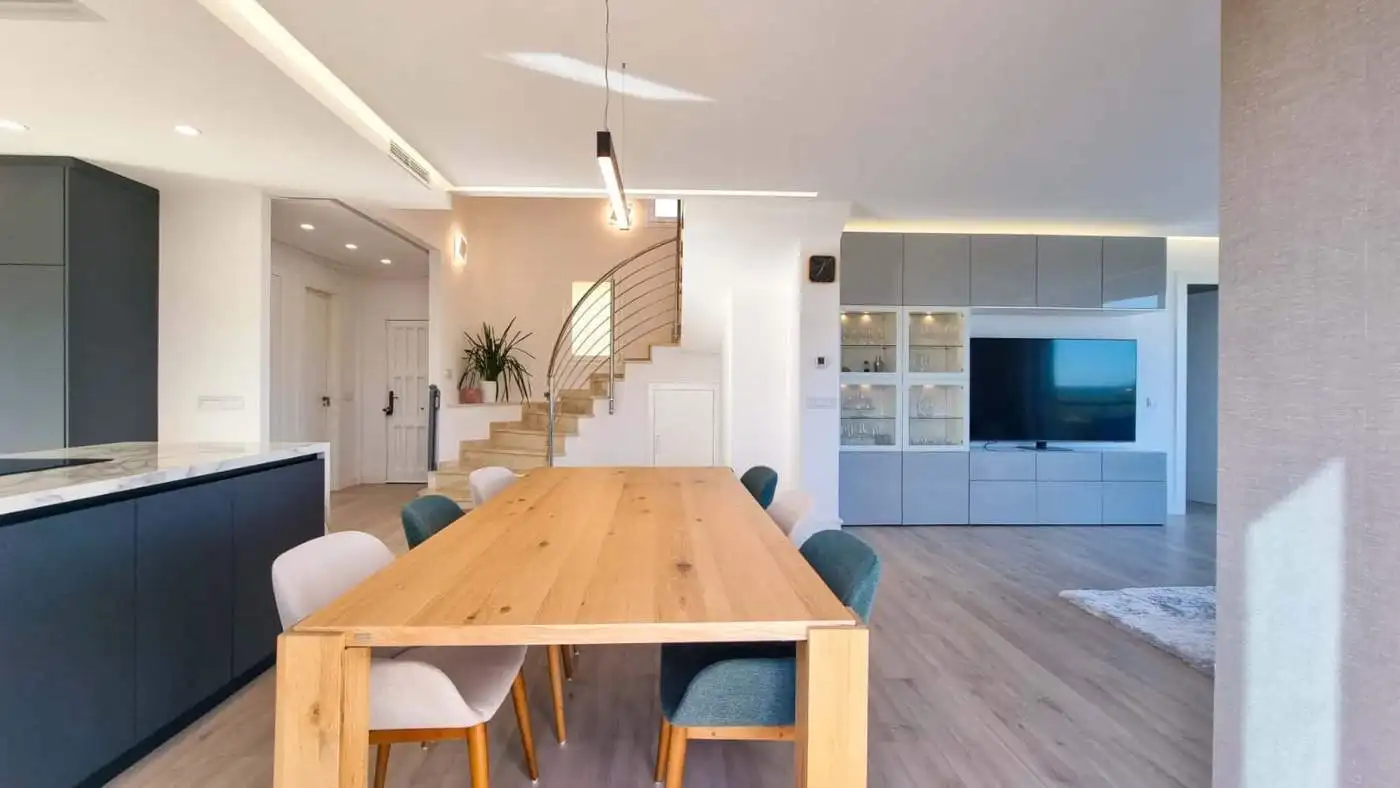 Elegant fully renovated penthouse showcasing panoramic sea views in San Roque Club. Modern interior.