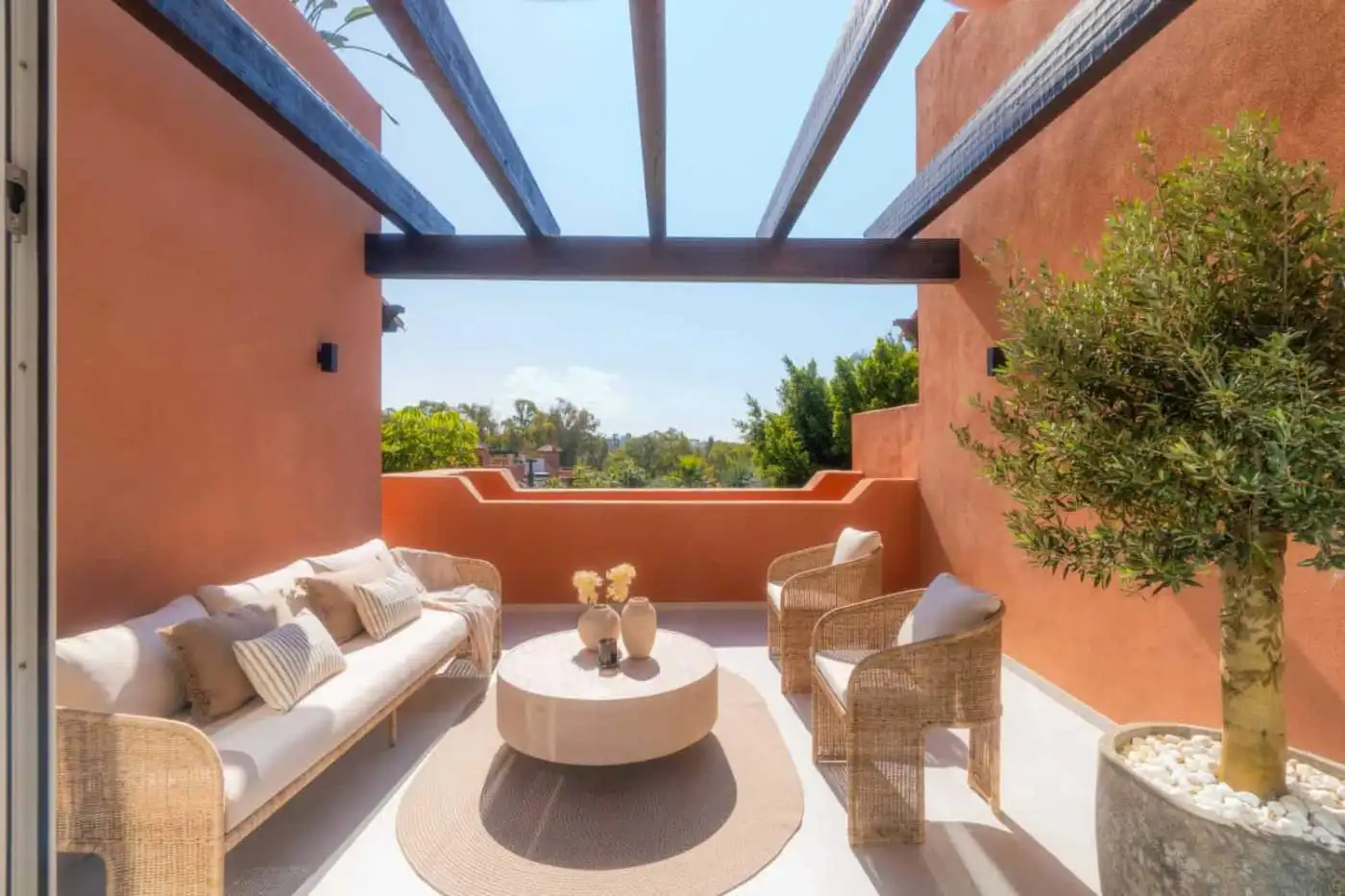 Luxurious duplex penthouse terrace in Marbella with stylish outdoor seating and panoramic views.
