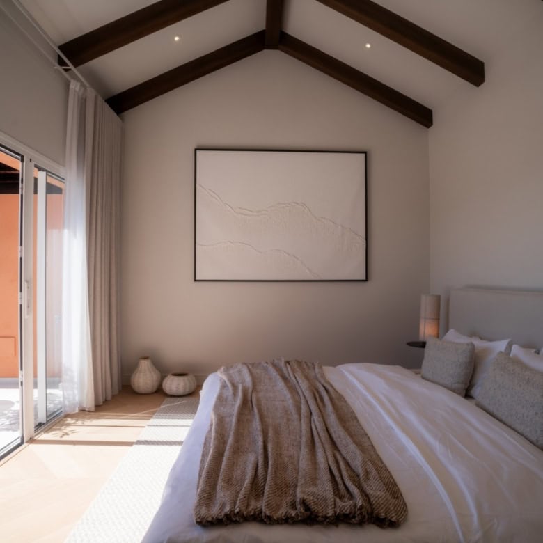 Elegant bedroom with modern decor in a renovated duplex penthouse in Marbella. Bright space with hig.