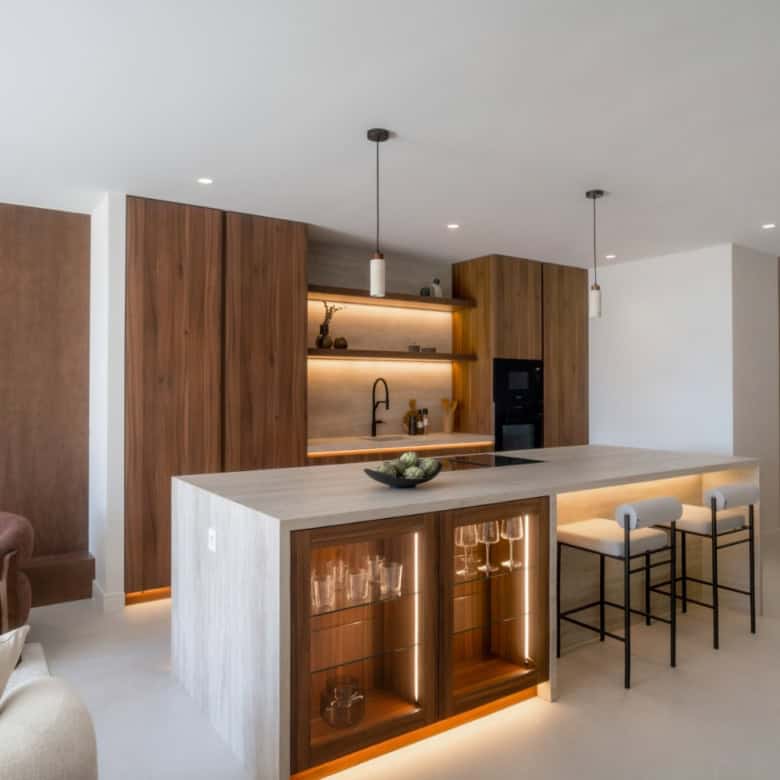 Renovated duplex penthouse kitchen with modern design and wooden accents in Marbella.