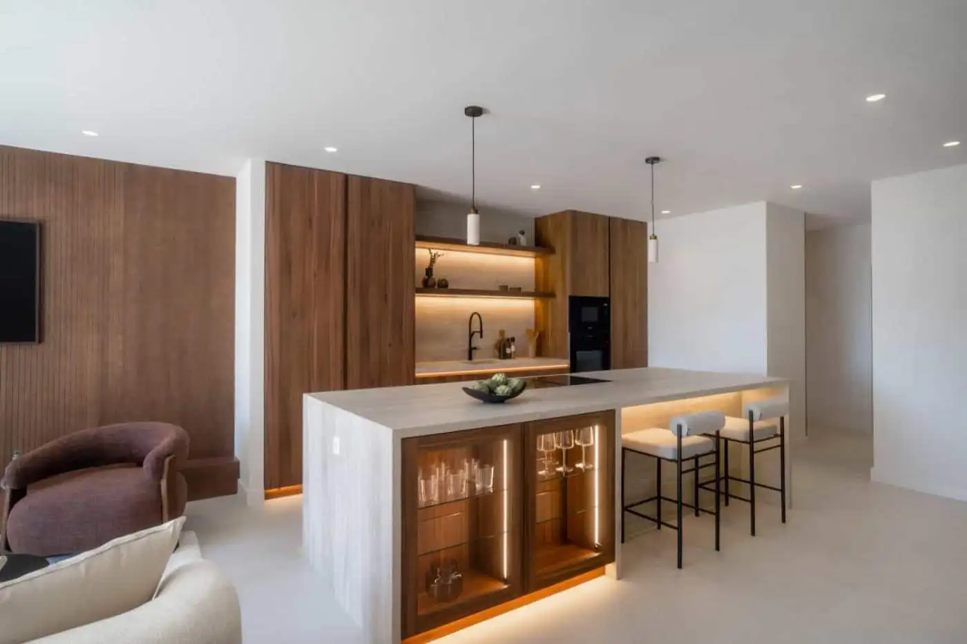 Renovated duplex penthouse kitchen with modern design and wooden accents in Marbella.