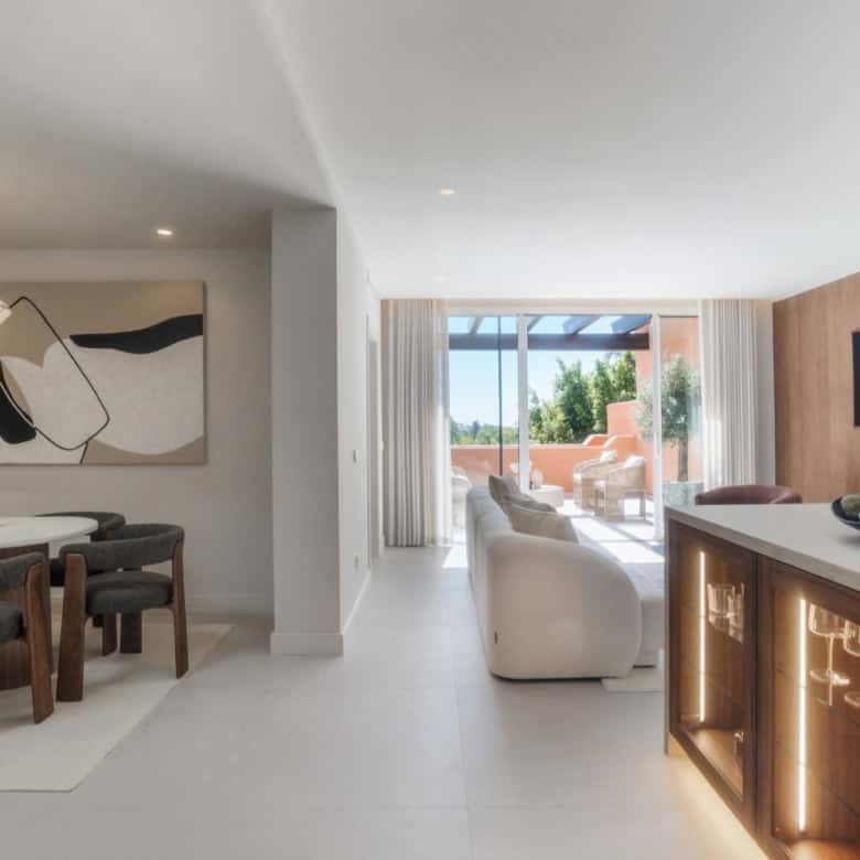 Elegant interior of renovated duplex penthouse in Alminar de Marbella with modern furnishings.