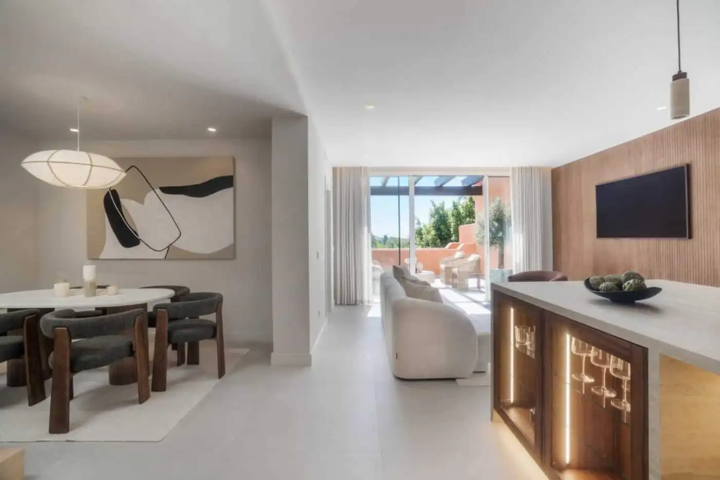 Elegant interior of renovated duplex penthouse in Alminar de Marbella with modern furnishings.