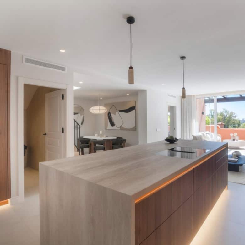 Luxury duplex penthouse in Marbella with modern design and spacious living area.