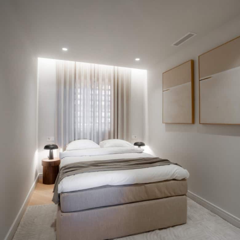 Renovated duplex penthouse bedroom with natural light in Marbella.