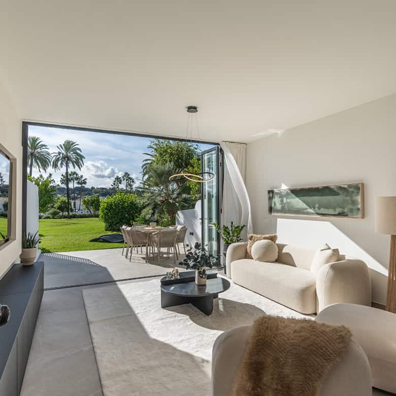 Spacious Marbella townhouse featuring modern interiors and a lush outdoor garden. Perfect for comfor.