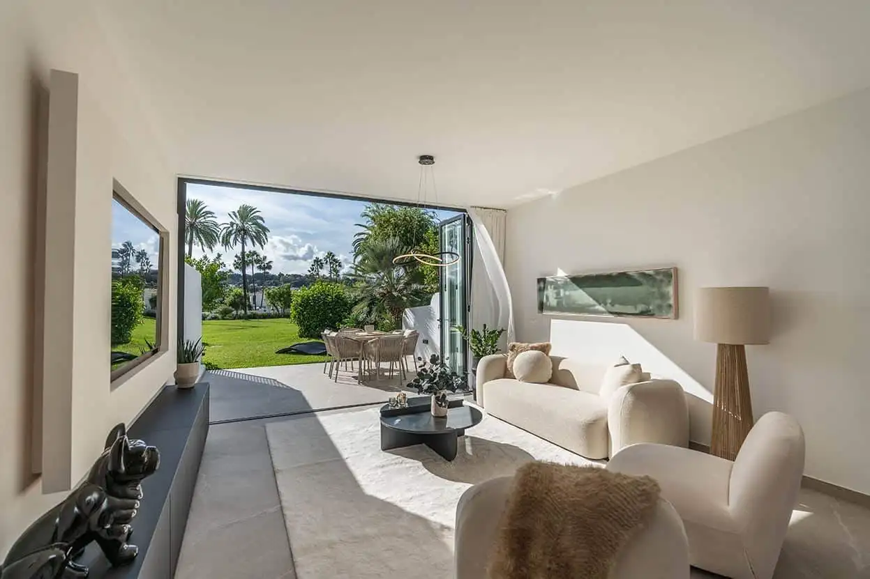 Spacious Marbella townhouse featuring modern interiors and a lush outdoor garden. Perfect for comfor.