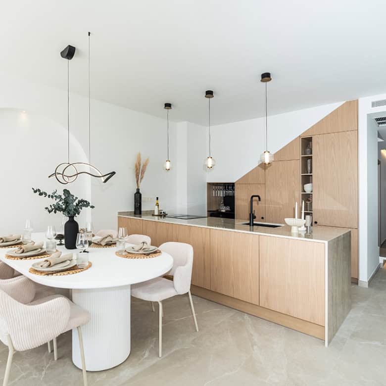 Bright Marbella townhouse kitchen with modern design and spacious dining area.