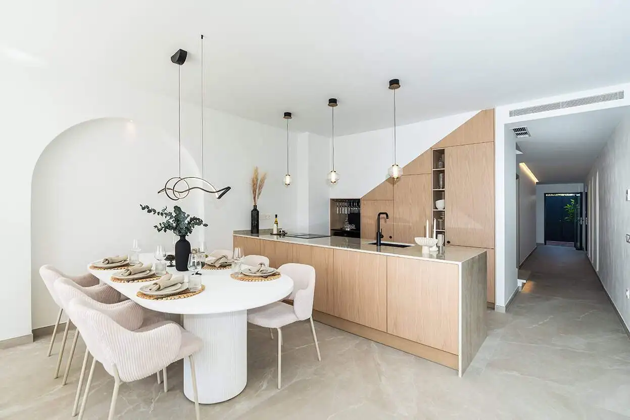 Bright Marbella townhouse kitchen with modern design and spacious dining area.