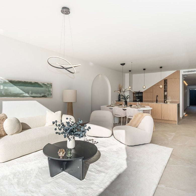 Spacious living area in a fully refurbished Marbella townhouse with contemporary decor and open-plan.