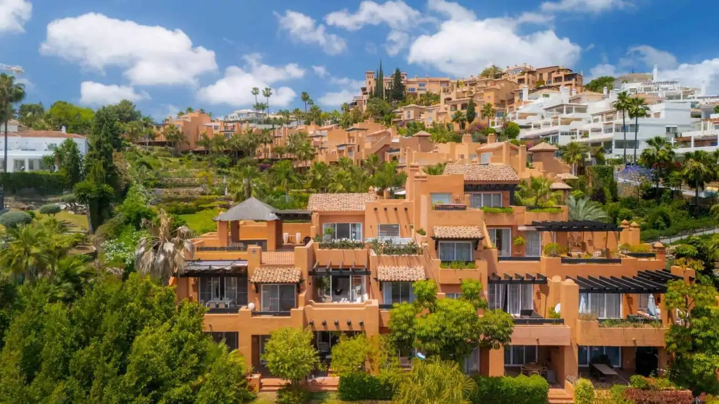 Modern duplex penthouse in Marbella with spacious terraces and scenic mountain views.