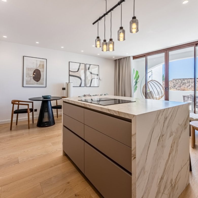 Contemporary kitchen and living space in a renovated townhouse in Los Arqueros.