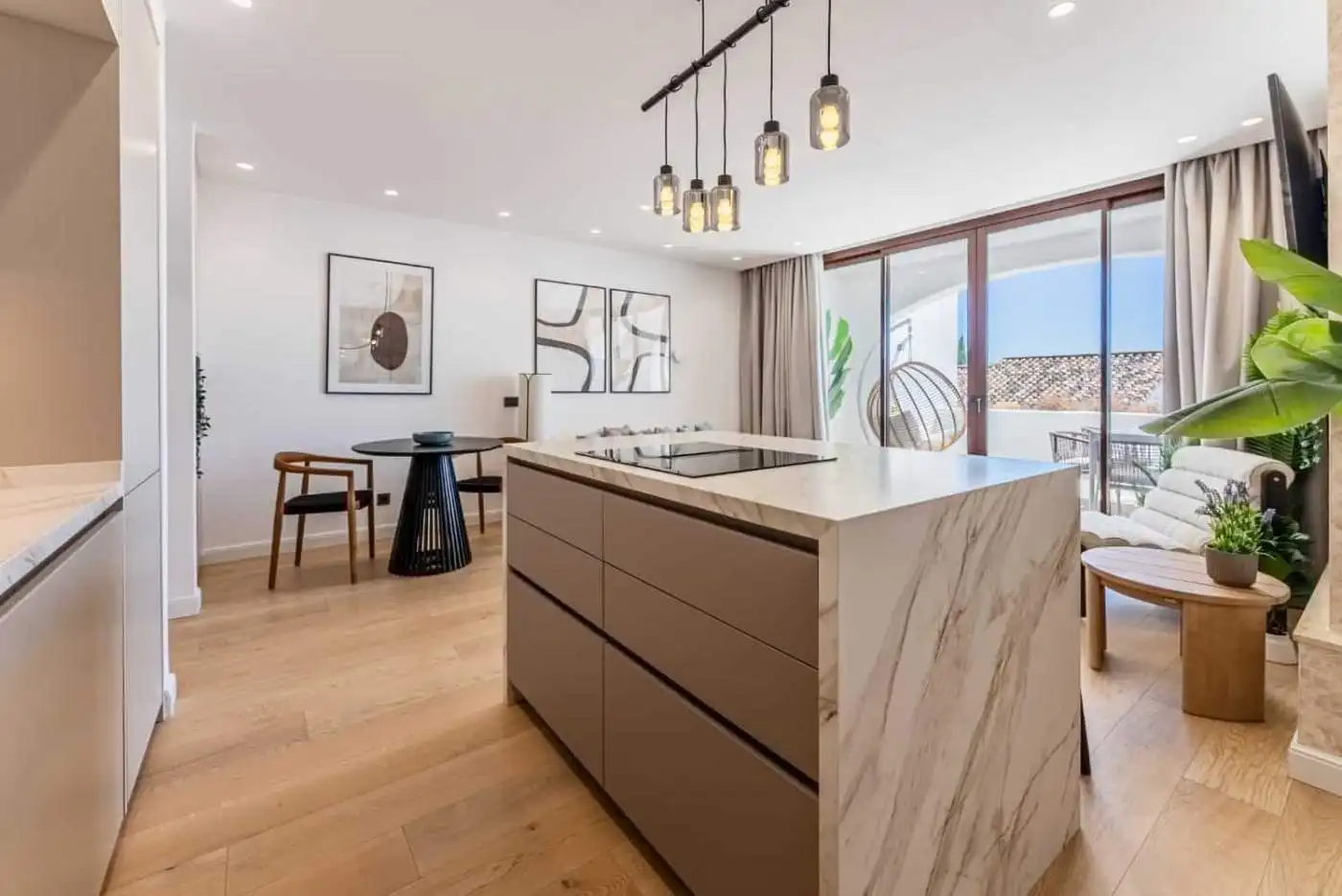 Contemporary kitchen and living space in a renovated townhouse in Los Arqueros.
