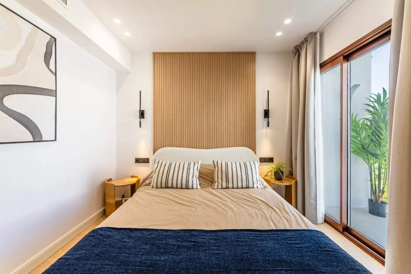 Refurbished townhouse bedroom with stylish decor in Los Arqueros Benahavis.