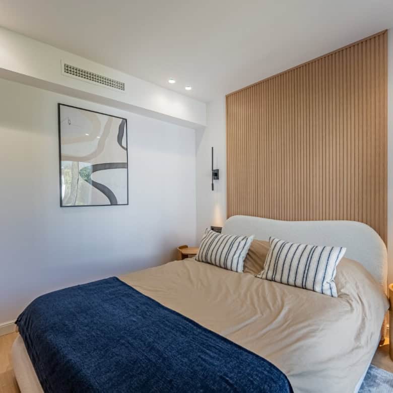 Beautifully refurbished townhouse bedroom with contemporary design and cozy atmosphere.