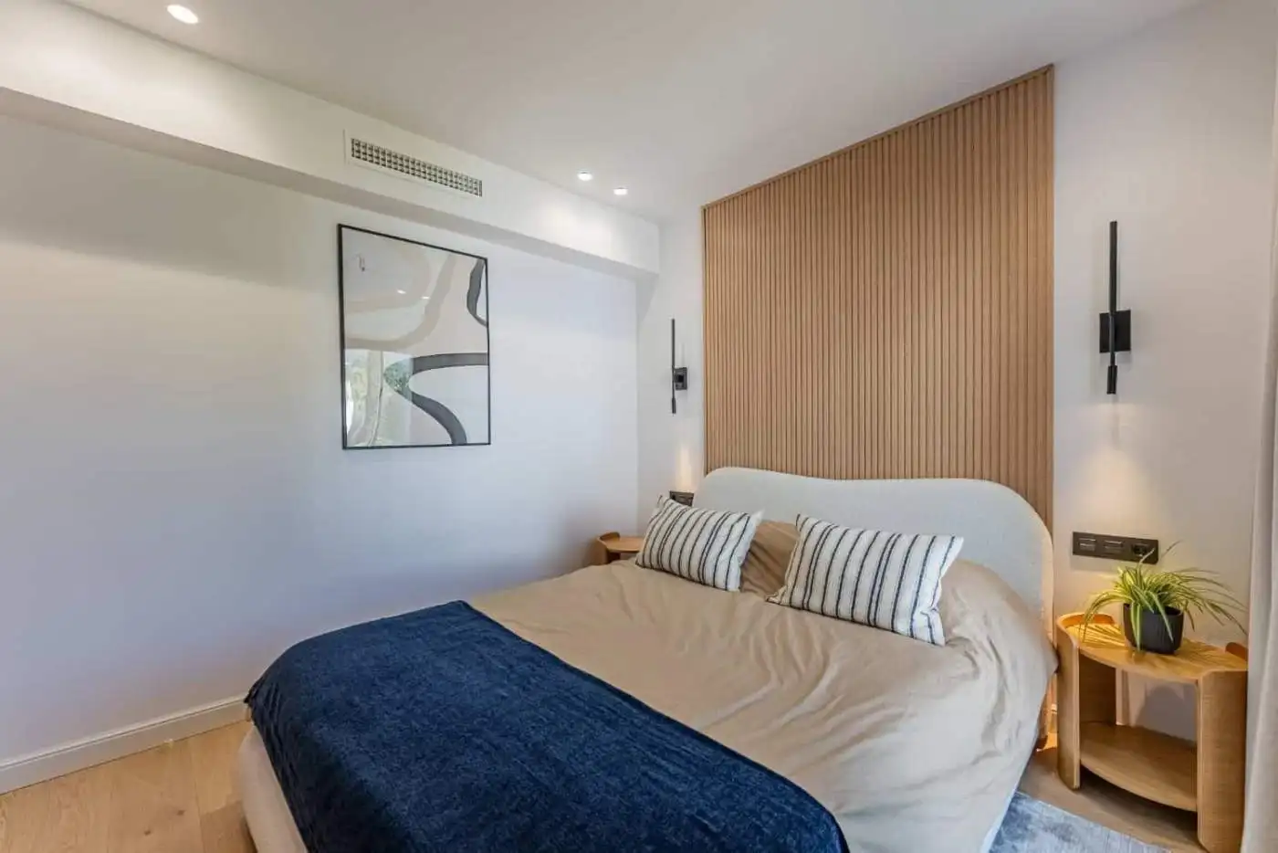 Beautifully refurbished townhouse bedroom with contemporary design and cozy atmosphere.