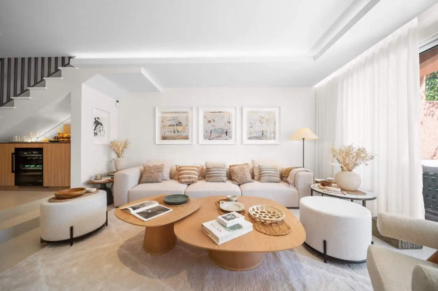 Elegant interior with neutral tones, stylish furniture, and natural light.