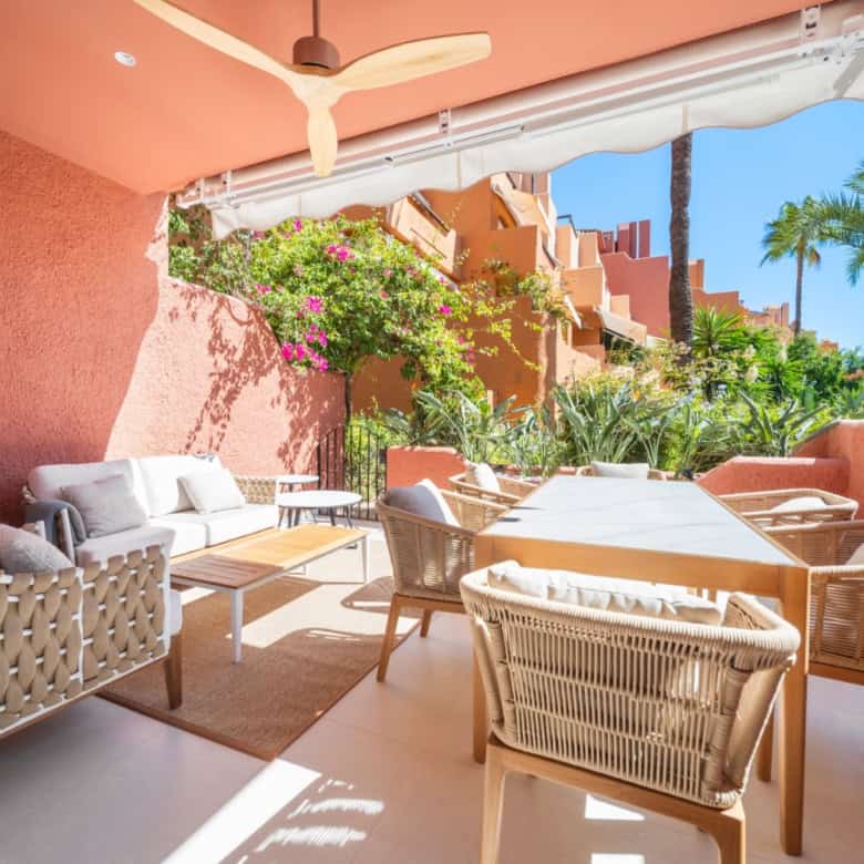 Spacious outdoor terrace of a luxury turnkey townhouse in El Palmeral, Nueva Andalucía, featuring co.