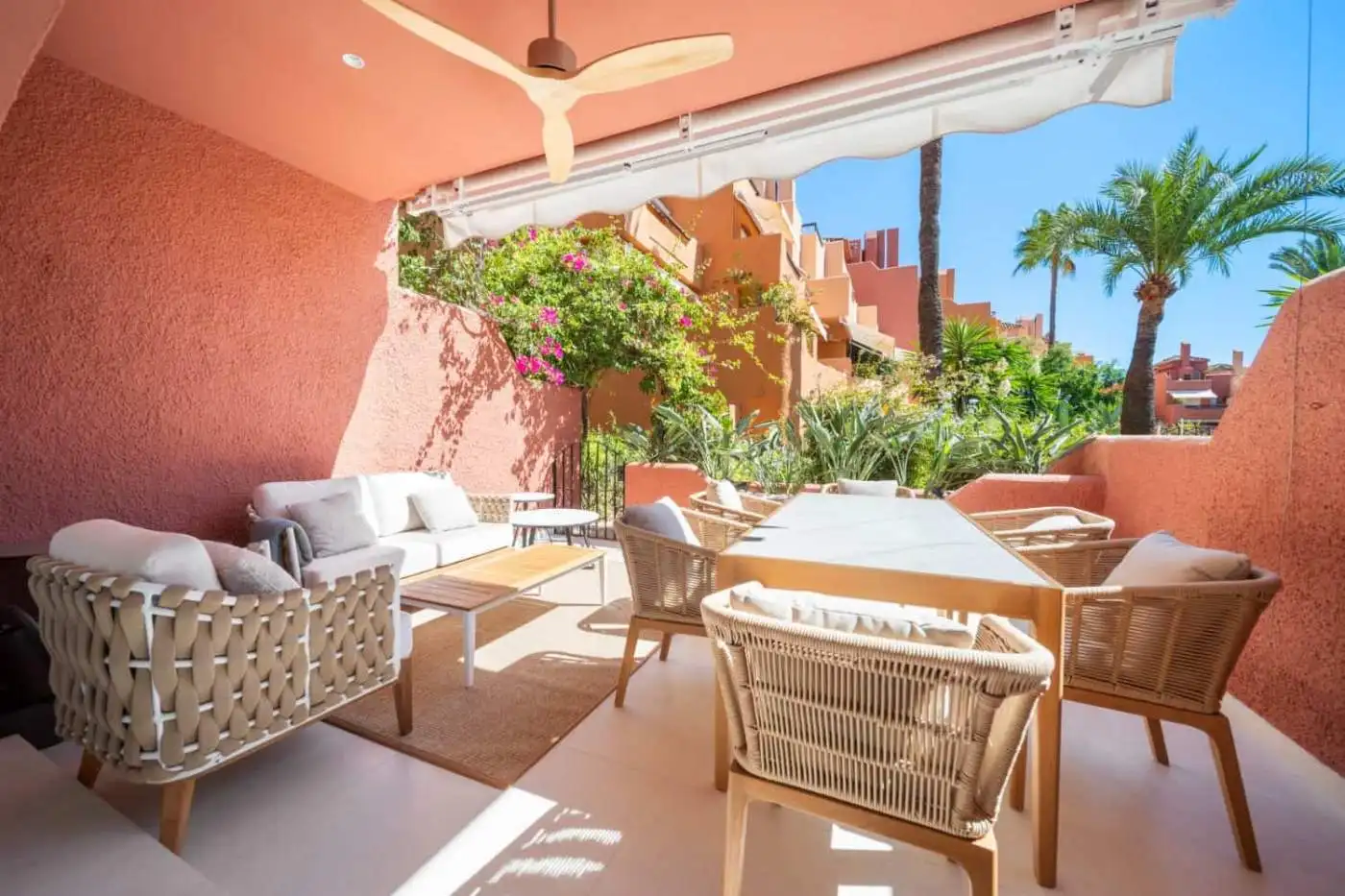 Spacious outdoor terrace of a luxury turnkey townhouse in El Palmeral, Nueva Andalucía, featuring co.