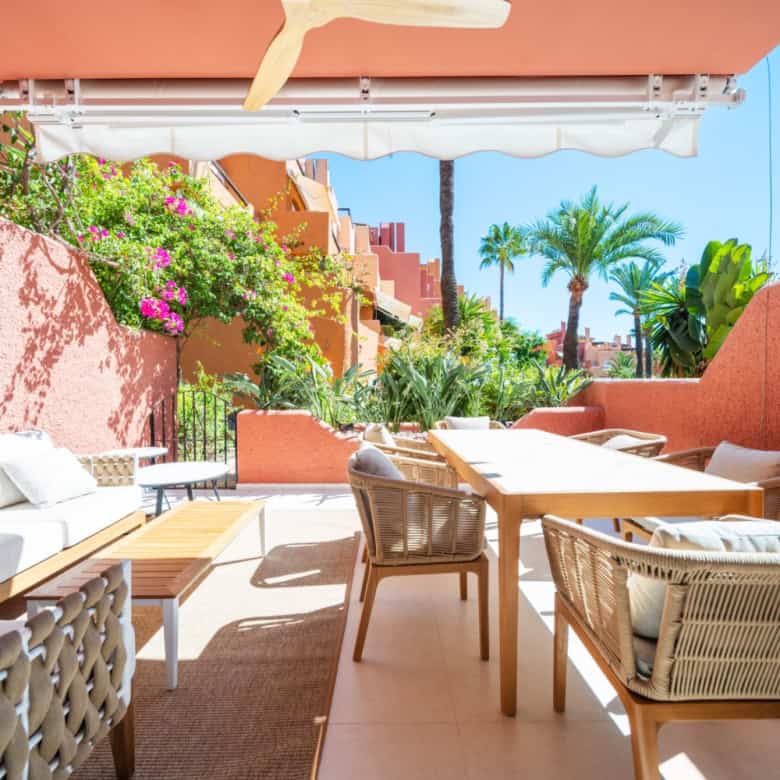 Spacious outdoor terrace of a luxury turnkey townhouse in El Palmeral, Nueva Andalucía, featuring co.