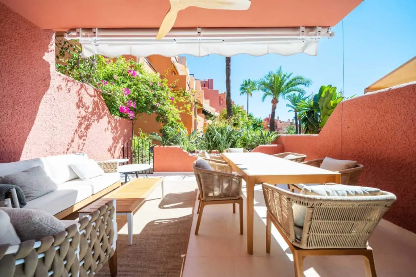 Spacious outdoor terrace of a luxury turnkey townhouse in El Palmeral, Nueva Andalucía, featuring co.