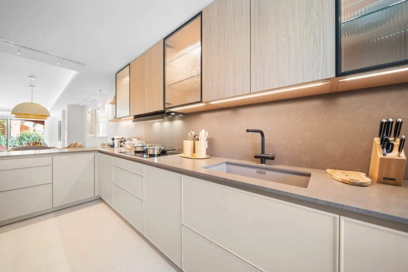 Modern kitchen with sleek cabinetry and contemporary design in El Palmeral, Nueva Andalucía.