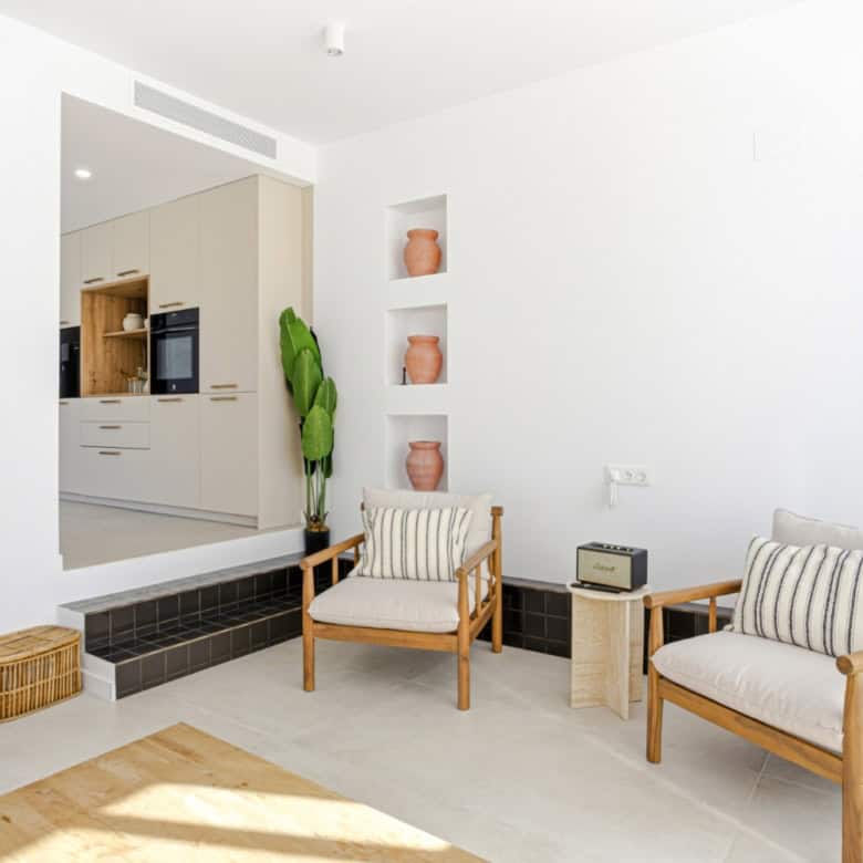 Bright and airy living room with minimalist decor in a corner townhouse in Cancelada, Estepona.