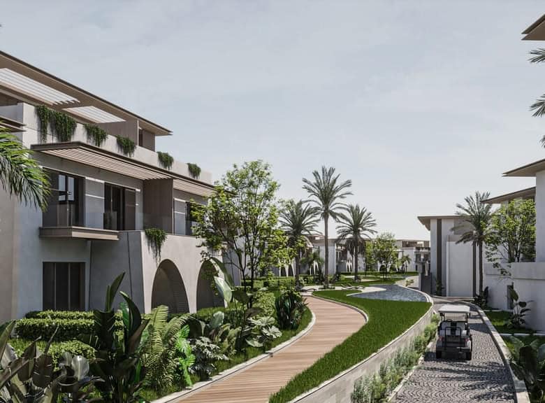 Contemporary tropical residential complex with lush greenery, palm trees, and modern architecture.