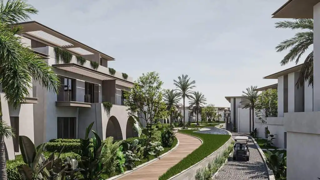 Contemporary tropical residential complex with lush greenery, palm trees, and modern architecture.