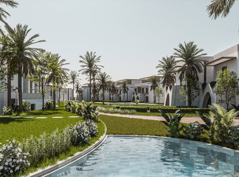 Luxury resort with palm trees and swimming pool for relaxation.