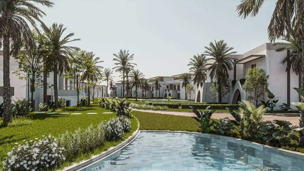 Luxury resort with palm trees and swimming pool for relaxation.
