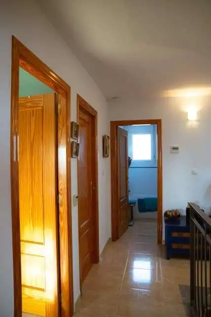 Beautiful interior view of a 4-bedroom villa in Totana Murcia, showcasing wooden doors and bright na.