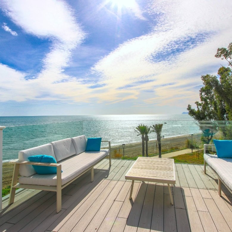Beachfront townhouse with stunning sea views in Estepona West. Modern design, spacious outdoor terra.