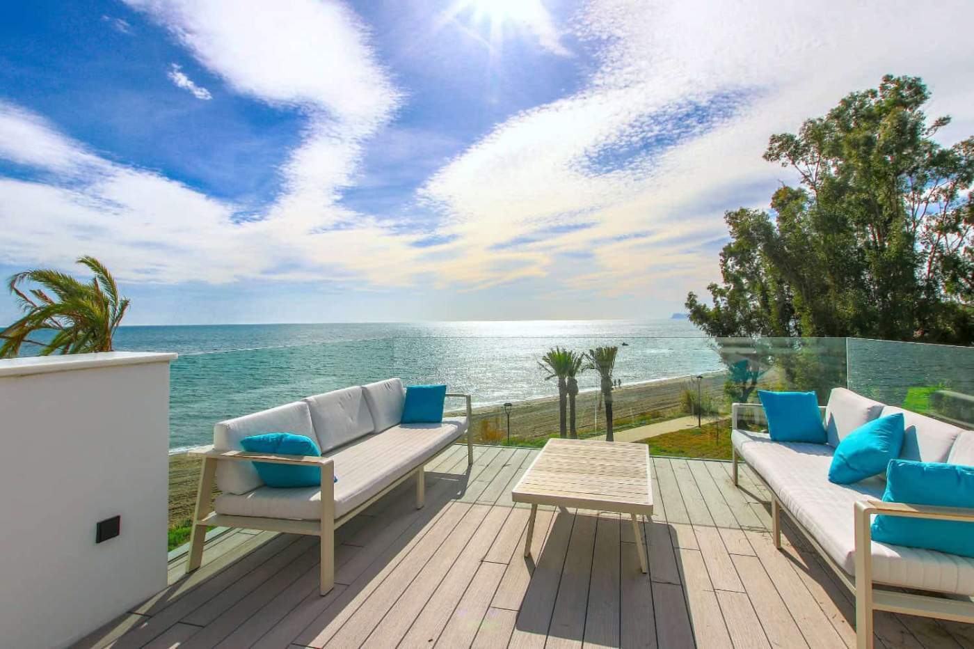 Beachfront townhouse with stunning sea views in Estepona West. Modern design, spacious outdoor terra.