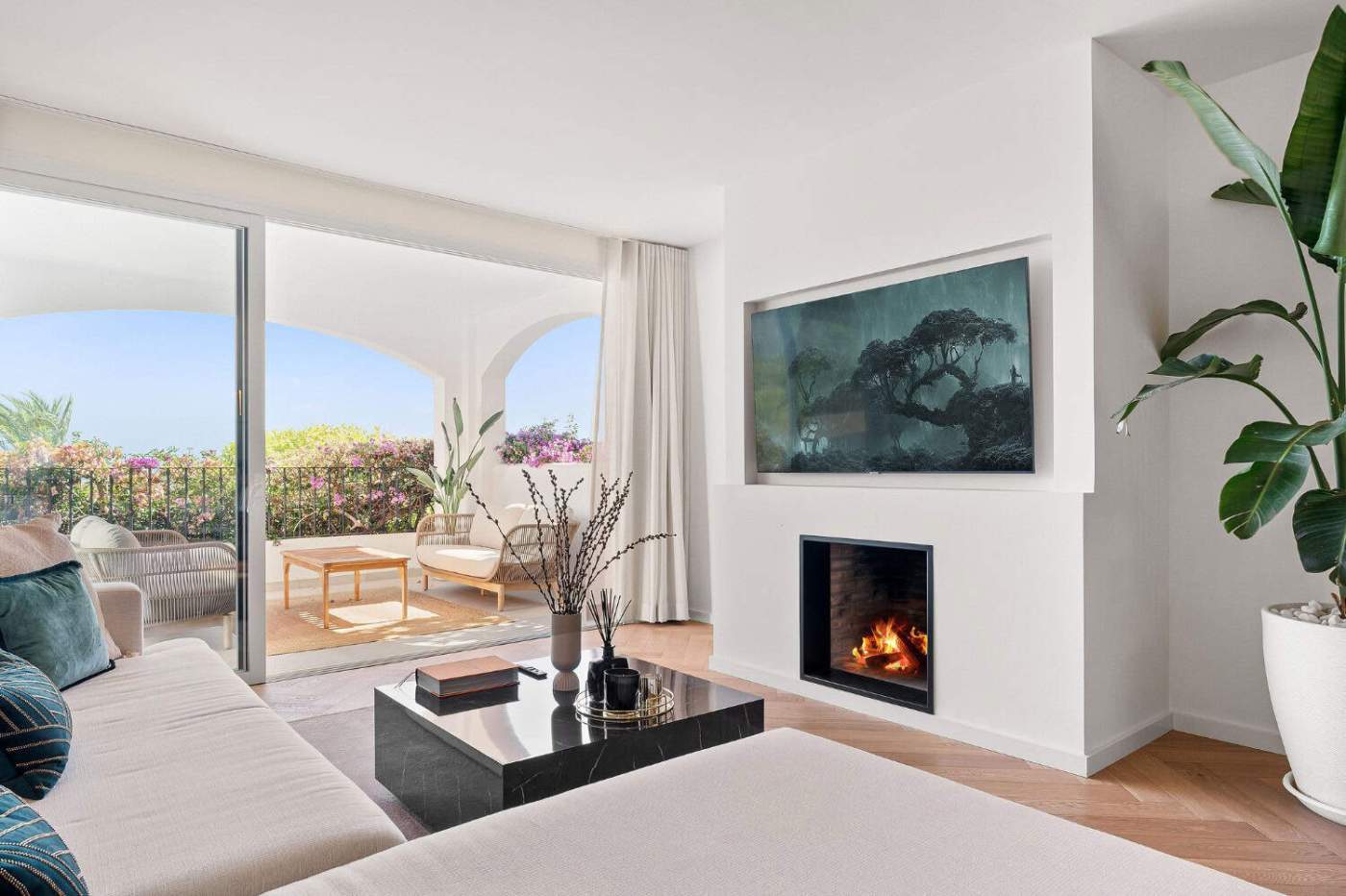 Luxury Townhouse Living Room Luxury townhouse living room with modern fireplace and large balcony view.