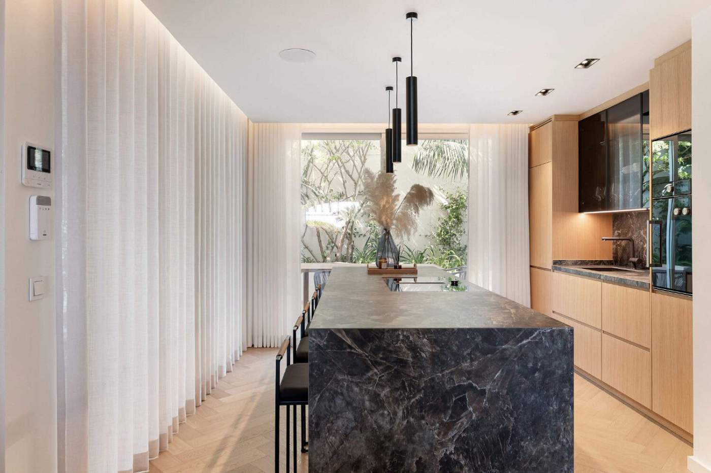 Luxury Townhouse Kitchen in Marbella Luxury townhouse kitchen with modern design and natural light in Marbella.