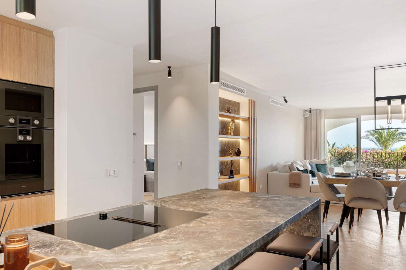 Luxury Townhouse Interior in Marbella Modern townhouse kitchen and living area in Marbella's Golden Mile. Elegant design with open-plan la.