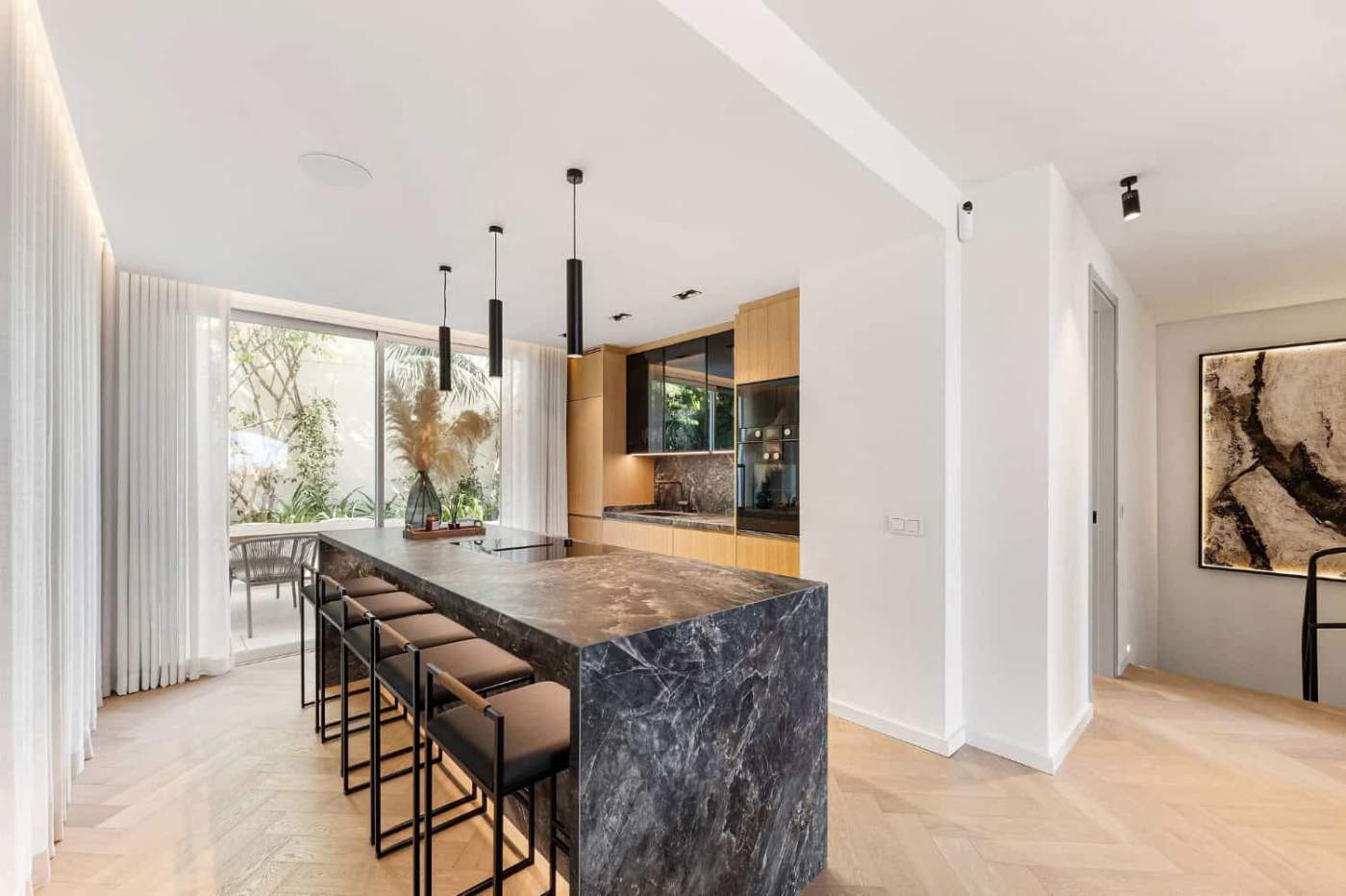 Luxury Townhouse Kitchen in Marbella Modern kitchen with marble island in Marbella townhouse.