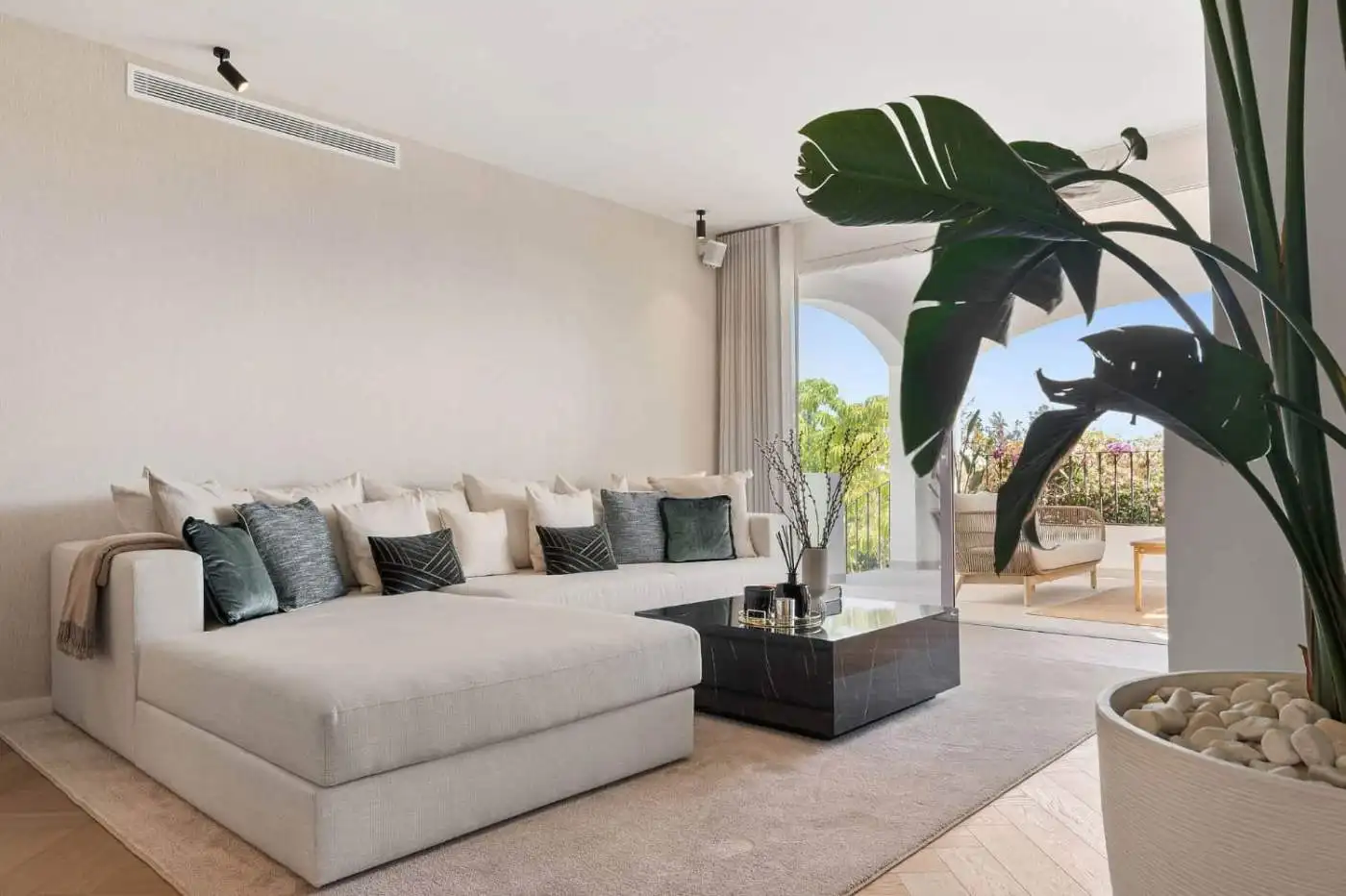 Elegant Marbella townhouse living room with modern decor and spacious seating area.