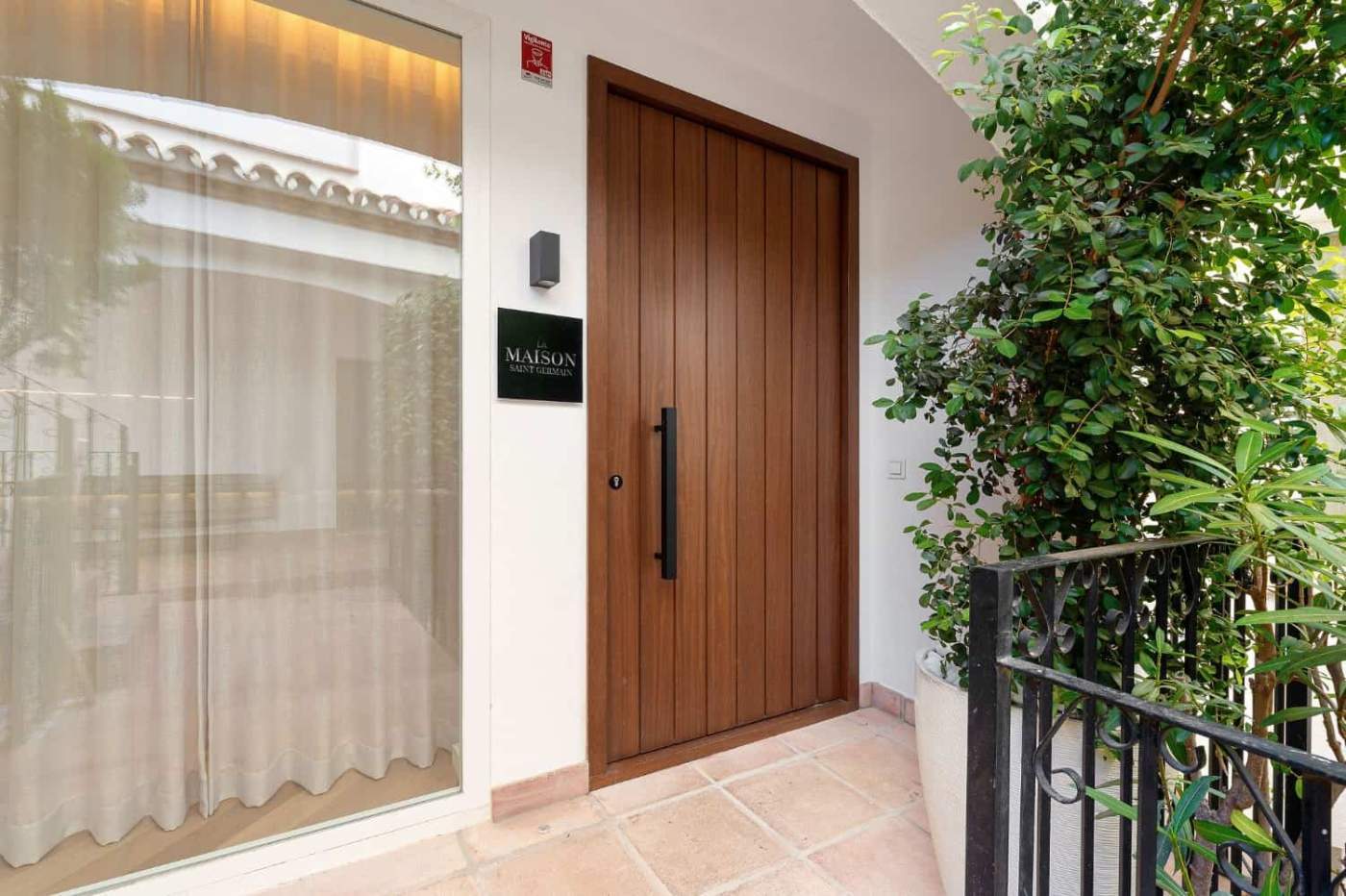 Luxury Townhouse Entrance in Marbella Entrance door of a luxury townhouse in Club Sierra, Golden Mile Marbella. Modern design with greener.