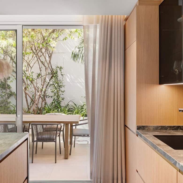 Modern kitchen with sliding glass doors to outdoor patio.