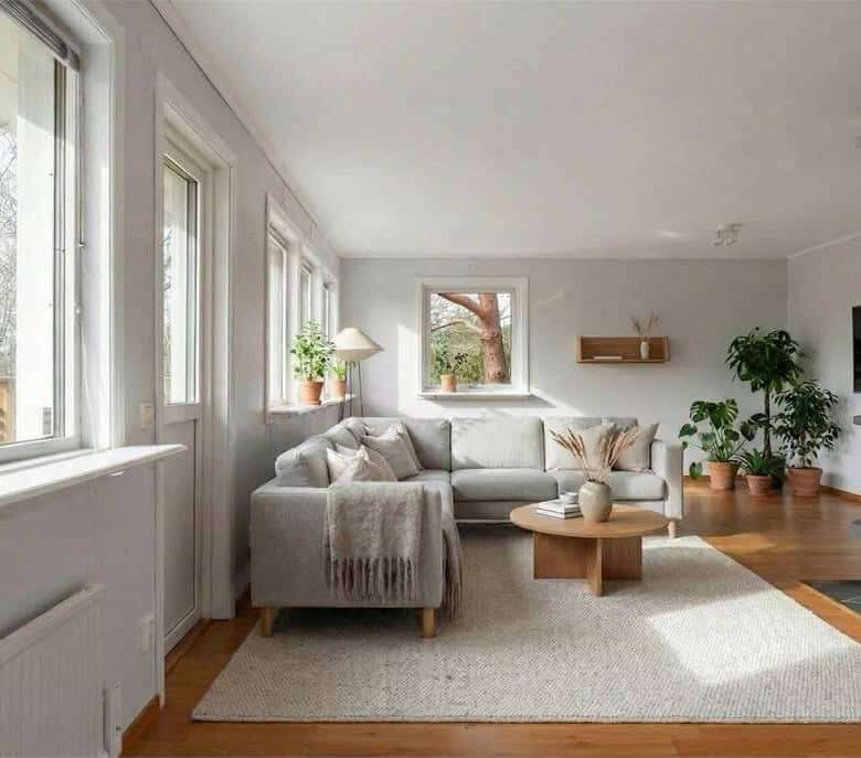 Bright living room with large windows and modern decor in Ljungskile. Perfect space for relaxing and.