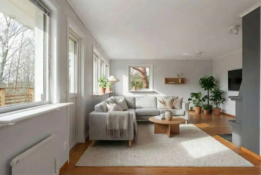 Bright living room with large windows and modern decor in Ljungskile. Perfect space for relaxing and.