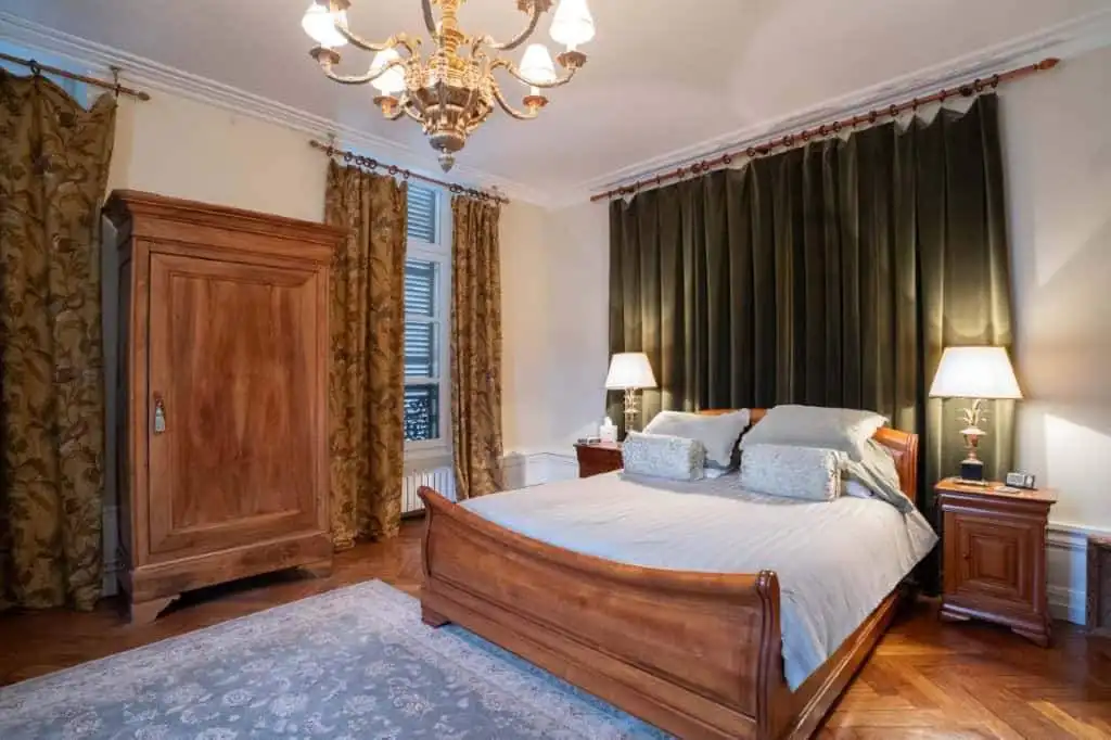 Elegant bedroom in a stunning 5-bed house in Chateaudun, France, featuring classic wooden furniture.