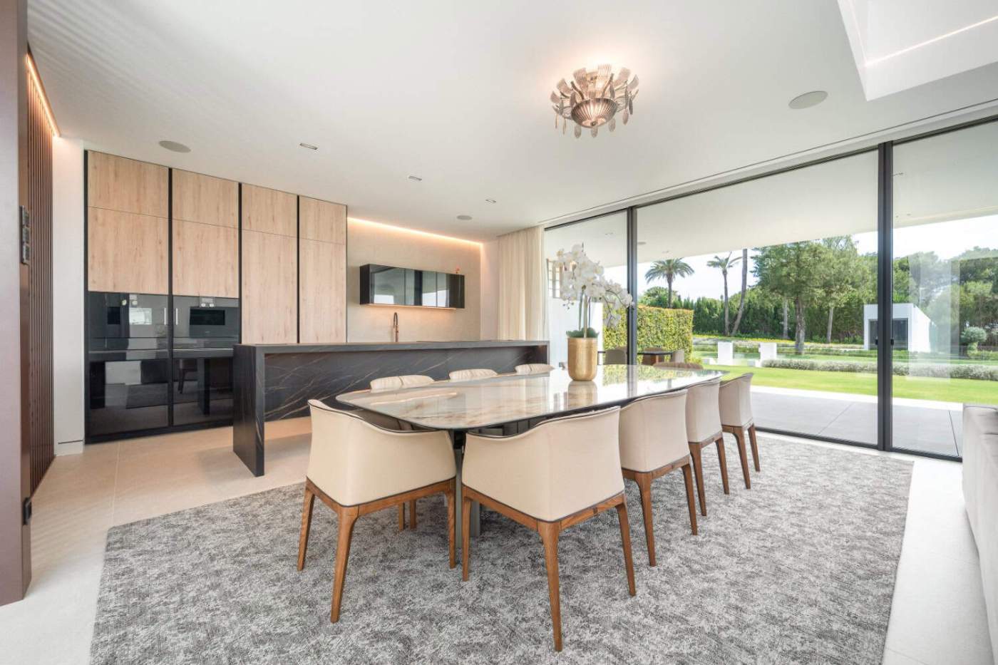 Luxurious Villa Interior with Modern Dining Area Elegant contemporary dining room with large windows and scenic views.
